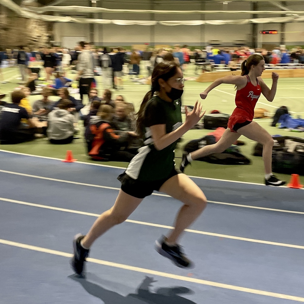 Tori Mainville-Mesarina (9) competes in the 200m dash at the Little Amik Invite.